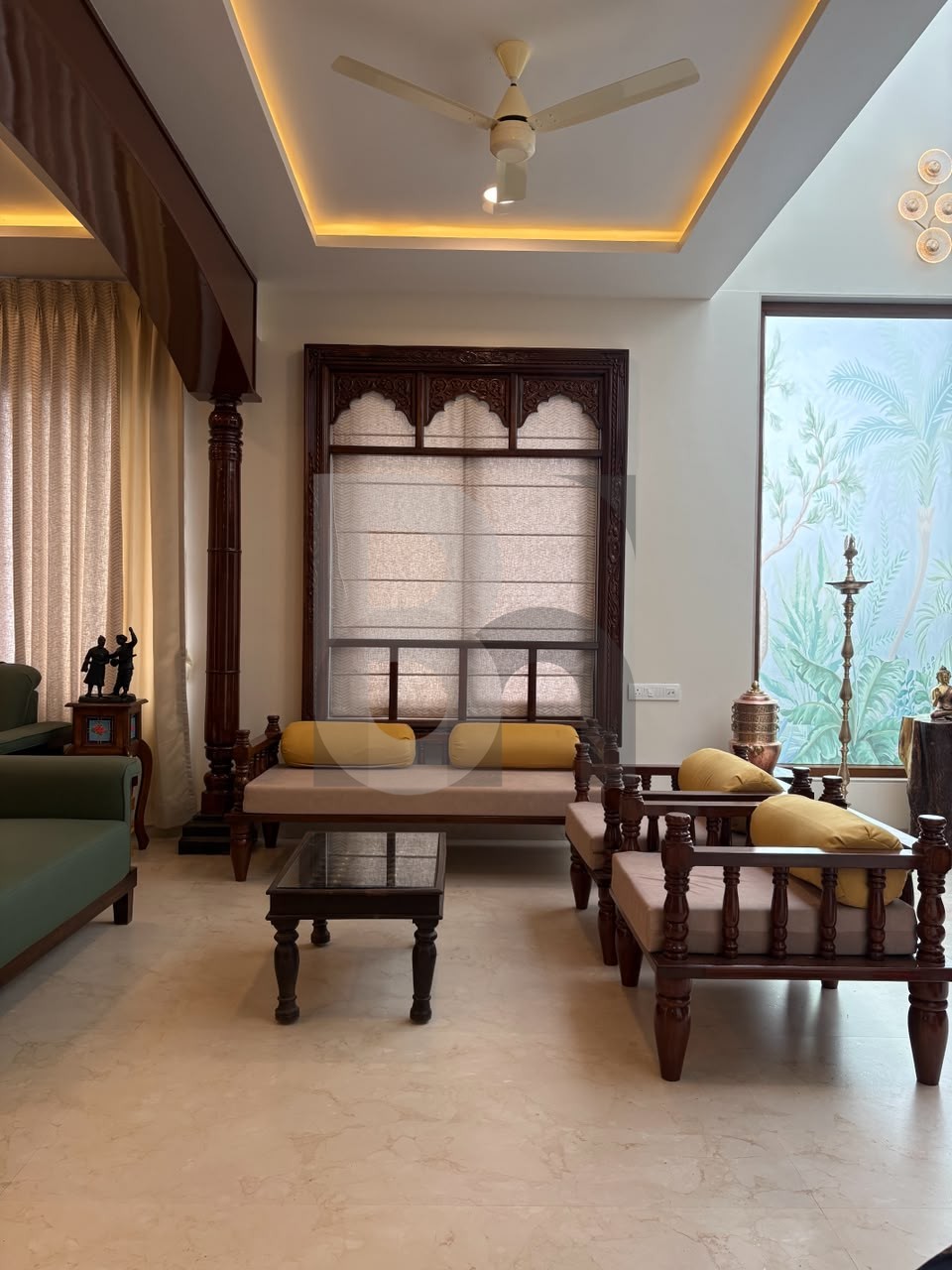 Traditional Indian living room with carved wooden window frame and solid wood sofa by Brand Meter