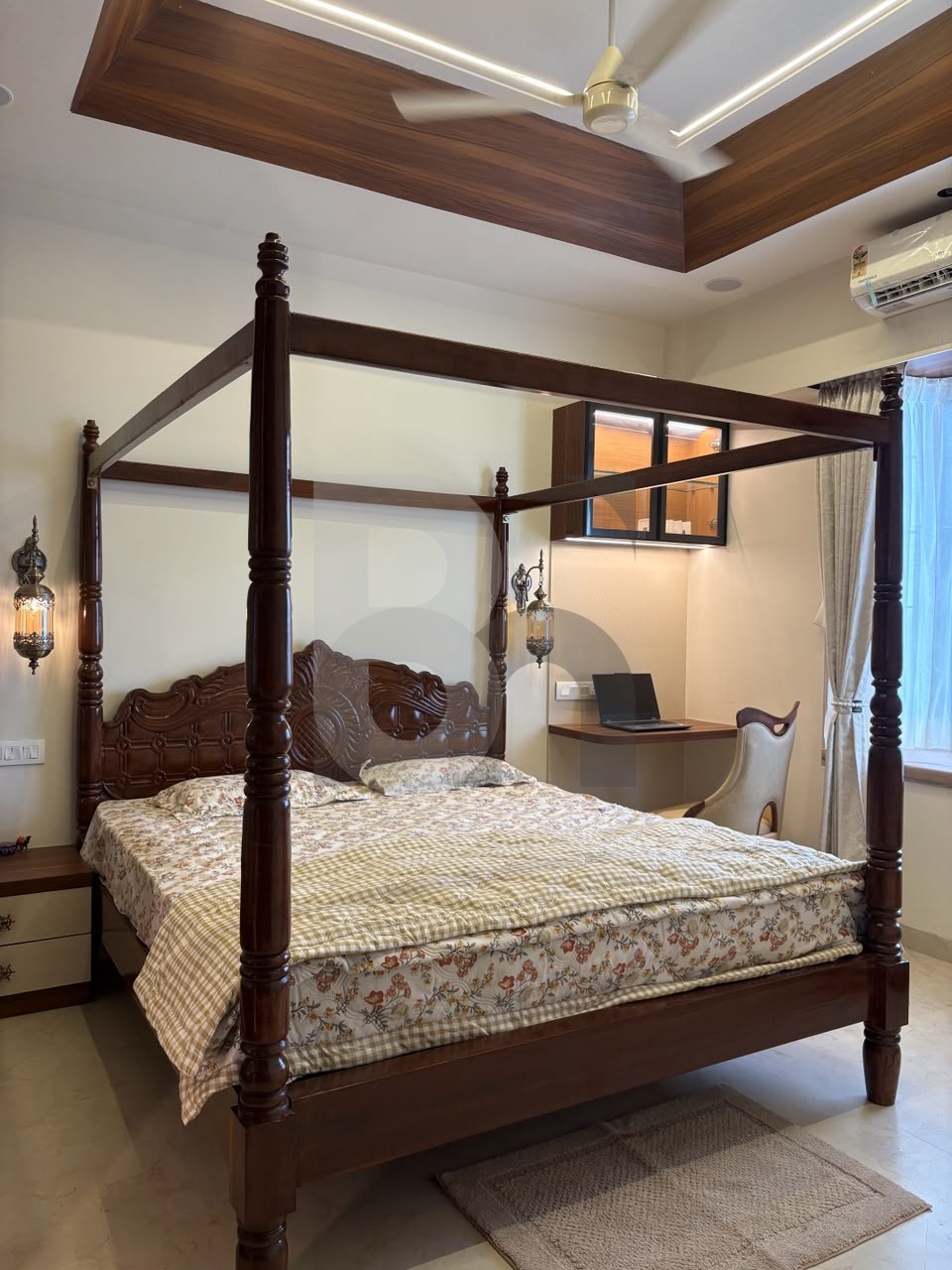 Regal bedroom with dark wood four-poster bed and floating study workstation by Brand Meter, Navi Mumbai