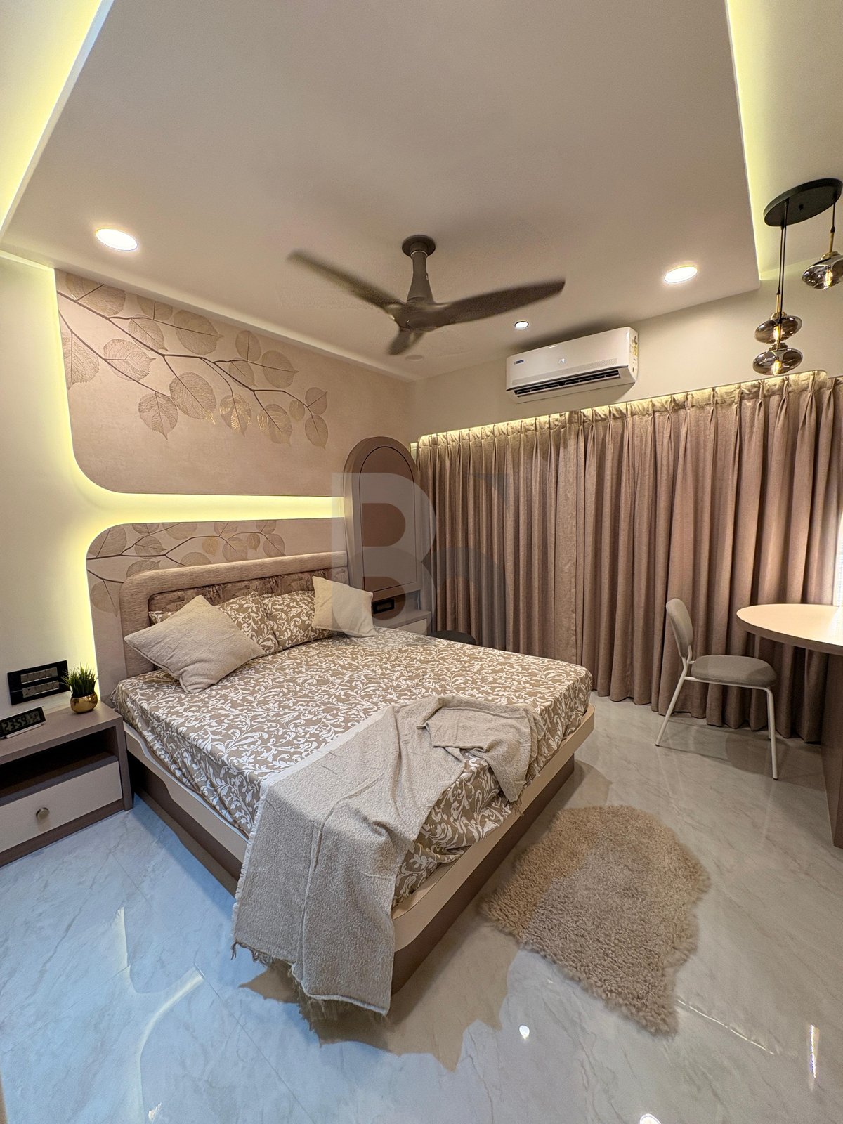 Spacious master bedroom with plush floor rug, warm cove ceiling lighting, and sheer drapery by Brand Meter