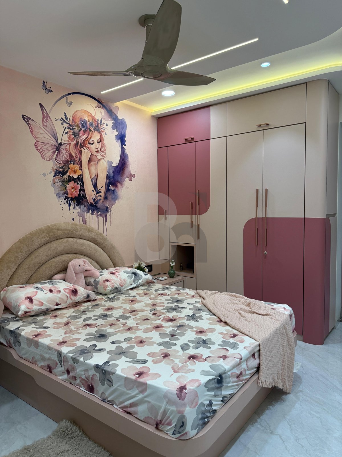 Kids bedroom with dual-tone mauve and grey floor-to-ceiling wardrobe and compact study unit by Brand Meter