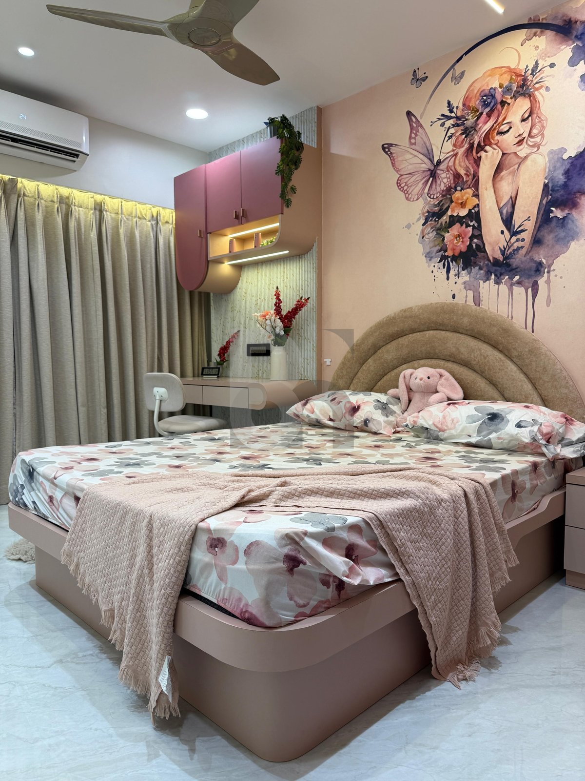 Close-up of luxury bedroom bed styling with arched velvet headboard and soft blush tones by Brand Meter
