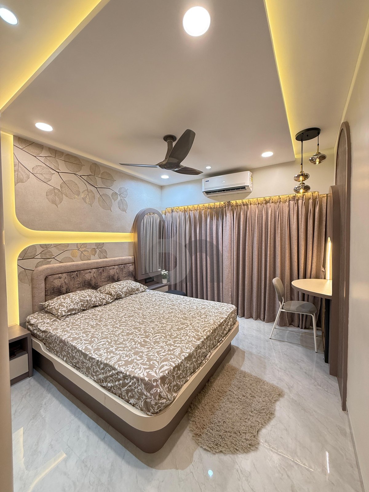 Warm ambient master bedroom with dual cove lighting, beige fabric curtains, and comfortable bed by Brand Meter
