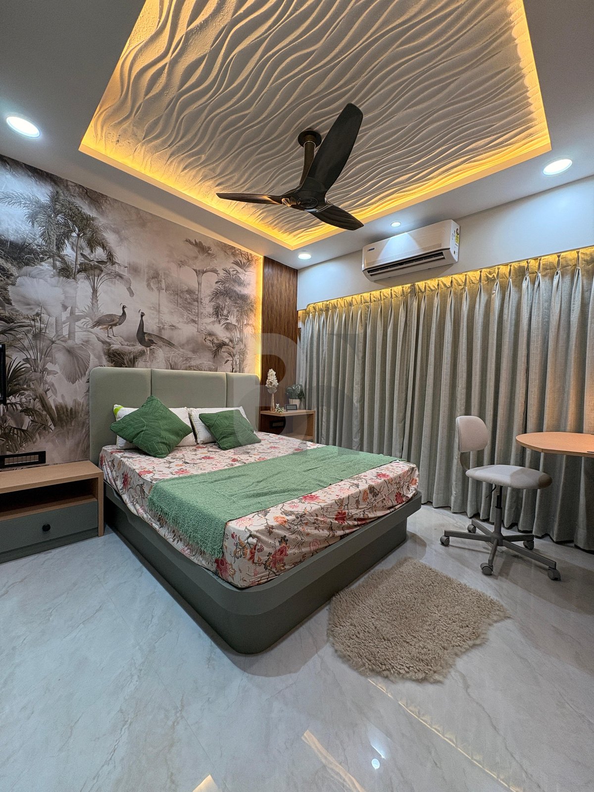 Bedroom ceiling design with sculpted sand dune texture and warm perimeter cove lighting by Brand Meter